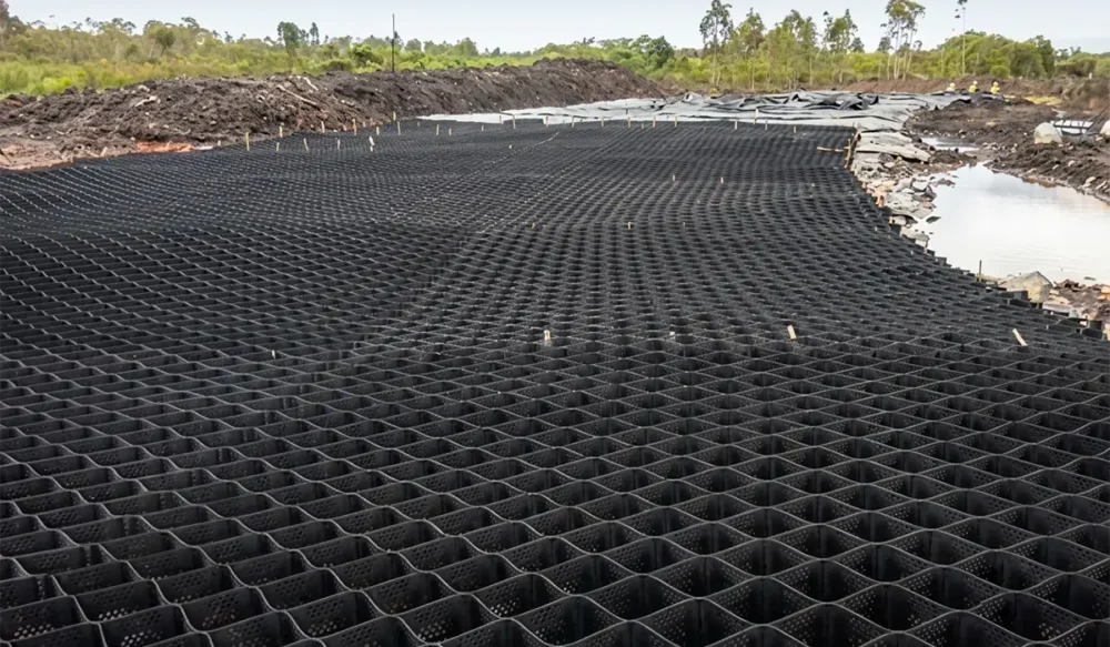 Geocell installed on a hauling road over soft soil in East Kalimantan